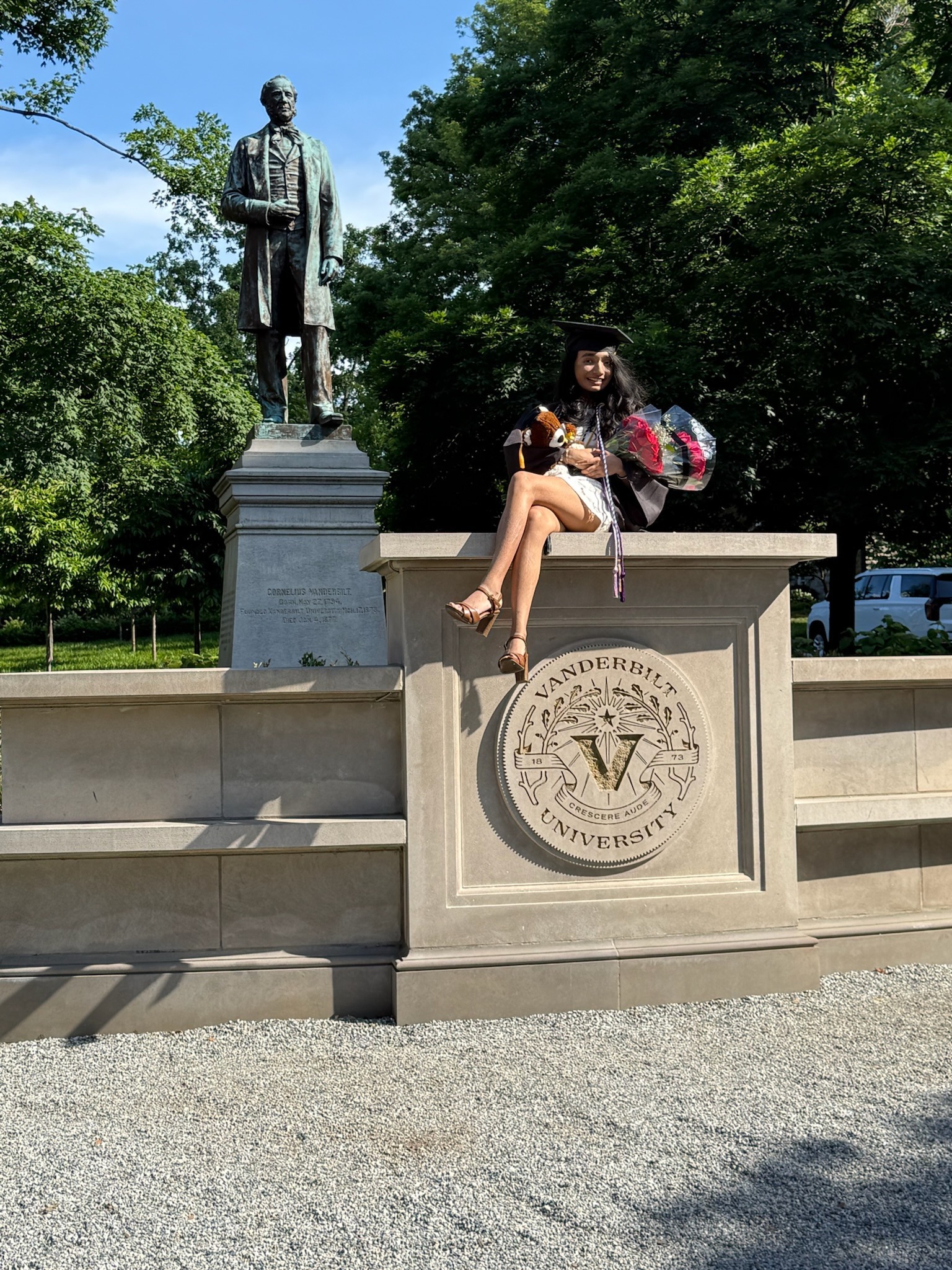 I celebrate Vanderbilt graduation beside the Cornelius Vanderbilt statue